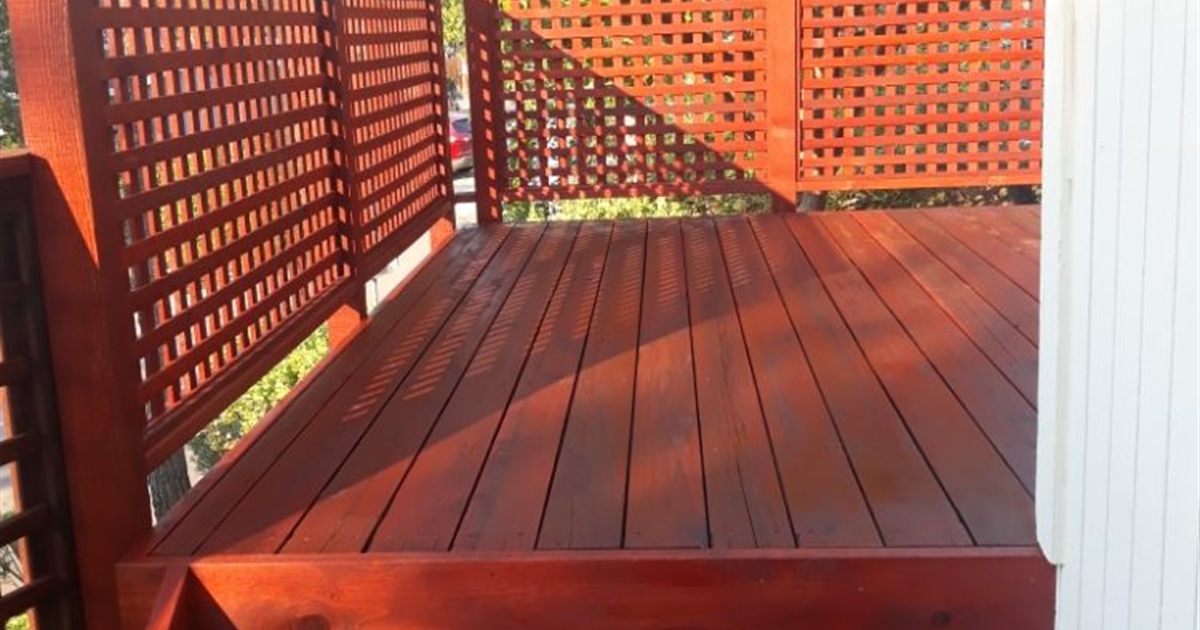 Freshly stained western red cedar deck in Portland, the upkeep side of the cedar vs composite decking decision